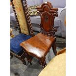 19th century mahogany hall chair with moulded and carved shield-shaped back,