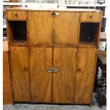 20th century figured walnut cocktail/entertainment cabinet having central cocktail cabinet with