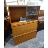 Modern Staples Ladderax display cabinet with glass sliding shelf above two panelled cupboards,