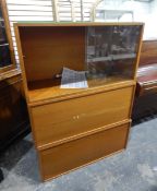 Modern Staples Ladderax display cabinet with glass sliding shelf above two panelled cupboards,