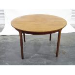 Teak circular extending dining table, by McIntosh,