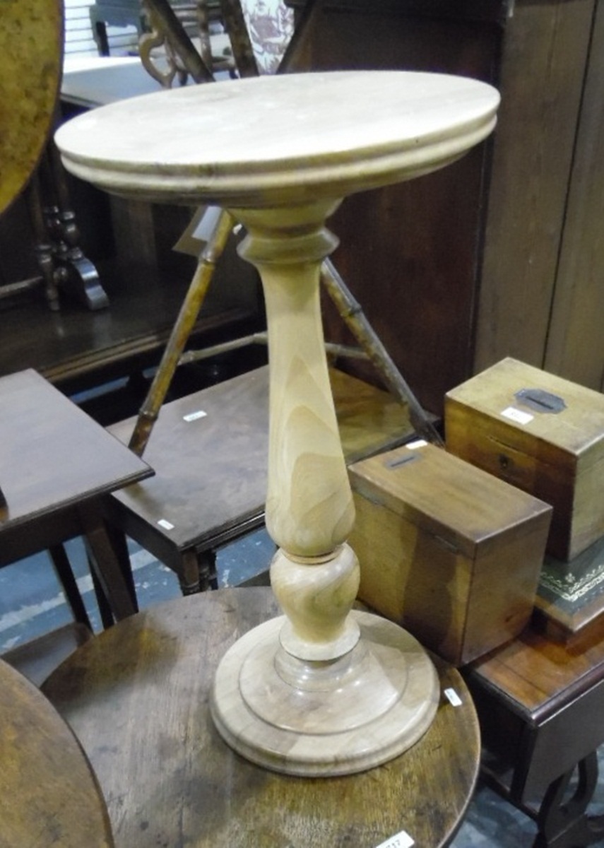 Mahogany circular occasional table on tripod support and a lightwood circular jardiniere stand (2)