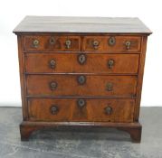 Early 18th century walnut veneered and cross-banded chest of two short and three long drawers,