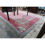Chinese wool rug, the red ground with green border decorated with bamboo and blossom,
