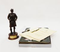 Spelter figure of a soldier from the Gordon Highlander's Regiment, associated leaflets, table mats,