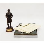 Spelter figure of a soldier from the Gordon Highlander's Regiment, associated leaflets, table mats,