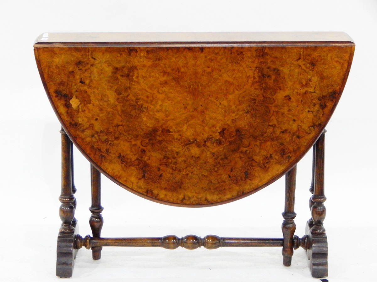 Victorian burr walnut veneered Sutherland table having twin-turned standards and turned pole