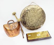 Brass gong of circular form with two beaters,