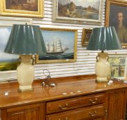 Pair of Oriental-style vase-shaped table lamps on brass plinth bases with brass handles and green