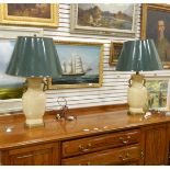 Pair of Oriental-style vase-shaped table lamps on brass plinth bases with brass handles and green