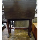 Mahogany Sutherland table with undershelf, on twin pedestal support,