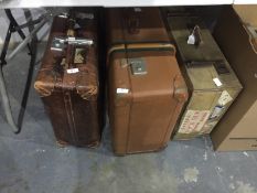 Three various travelling cases with shipping labels