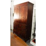 Early 19th century mahogany linen press having flat moulded cornice, over two panelled doors,