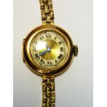 Lady's early 20th century gold-coloured watch with circular dial,