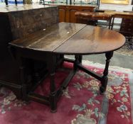 18th century oak fall-flap gateleg table on baluster turned supports,