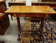 Victorian figured walnut veneered foldover card table on twin reeded standards,