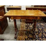 Victorian figured walnut veneered foldover card table on twin reeded standards,