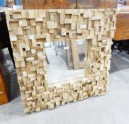 Contemporary square mirror within a random block frame