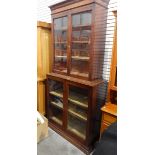 19th century cross-banded mahogany bookcase/display cabinet enclosed by two glass panelled doors