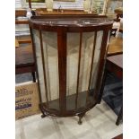 Mid 20th century demi-lune dark stained display cabinet on squat cabriole supports,