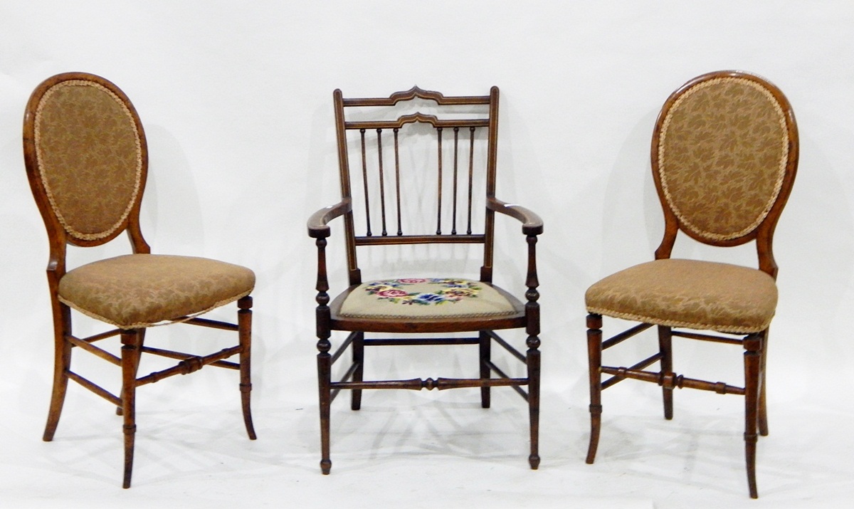 Edwardian line inlaid mahogany elbow chair having shaped crest-rail,