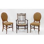 Edwardian line inlaid mahogany elbow chair having shaped crest-rail,