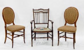 Edwardian line inlaid mahogany elbow chair having shaped crest-rail,