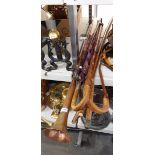 Copper hunting horn, an ebonised walking stick with silver finial and further walking sticks,