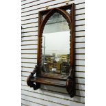 Victorian Gothic-revival carved oak framed wall mirror with lancet-shaped plate,