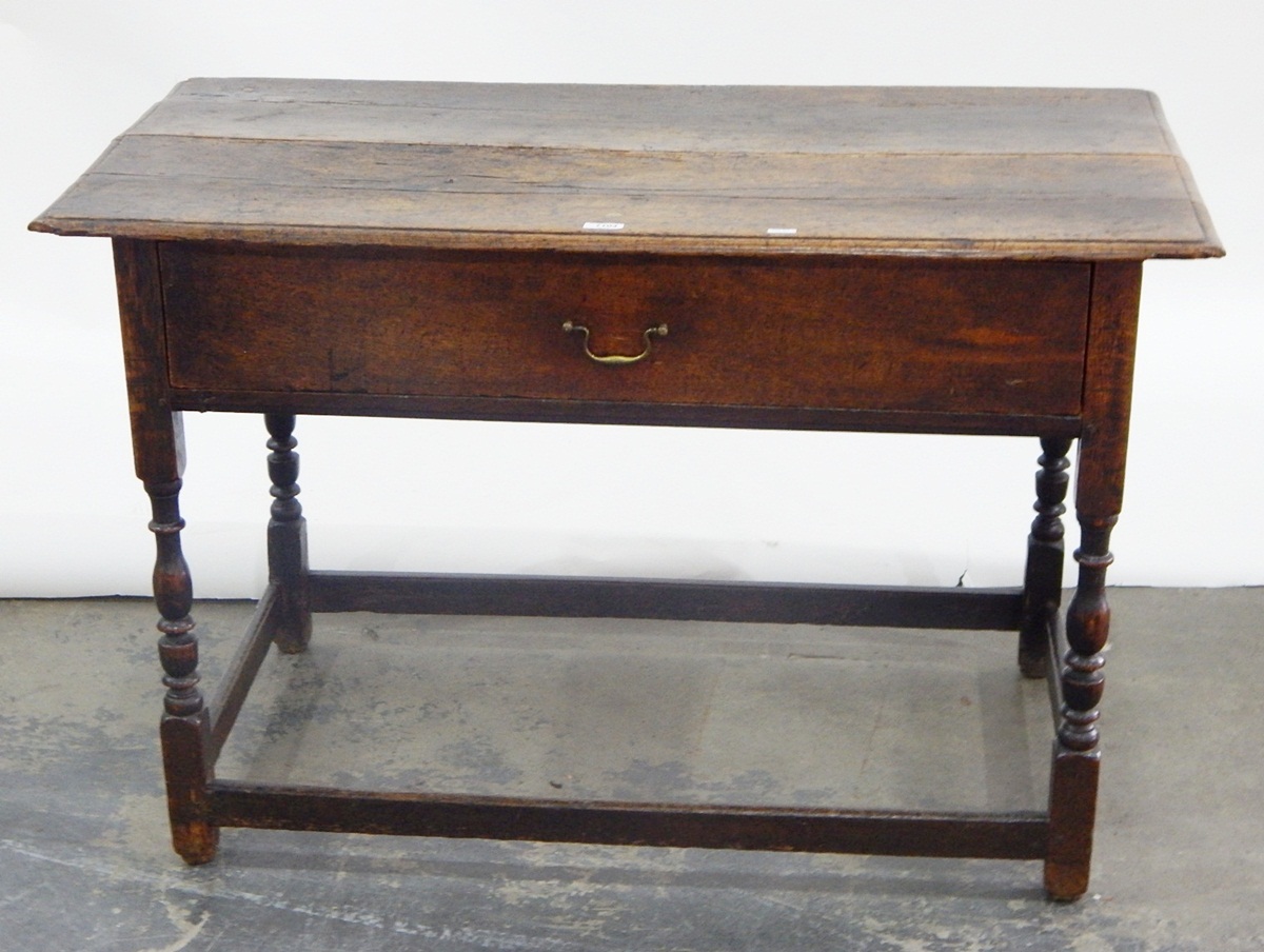 18th century oak side table, the rectangular top with moulded edge, with long frieze drawer,