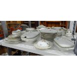 Limoges part dinner service comprising tureens, serving plates, dinner plates, gravy boat etc.