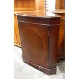 Mahogany bowfront corner cupboard raised on bracket feet,