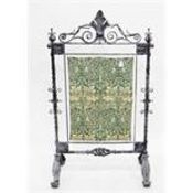 Late 19th/early 20th century iron firescreen frame of Arts & Crafts style,