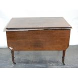 19th century mahogany dining table with rounded drop flaps and a central extra leaf,