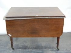 19th century mahogany dining table with rounded drop flaps and a central extra leaf,