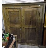 19th century pine kitchen cupboard, the pair of panelled doors enclosing shelves,