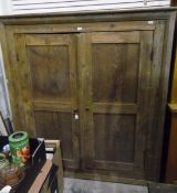 19th century pine kitchen cupboard, the pair of panelled doors enclosing shelves,