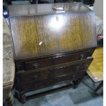 20th century oak bureau with fitted interior, three long drawers,