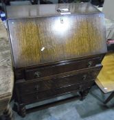 20th century oak bureau with fitted interior, three long drawers,