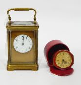 Brass carriage clock, the circular enamel dial with Arabic numerals,