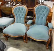 Pair of Victorian ladies and gentlemen's mahogany-framed spindle back, button upholstered chairs,