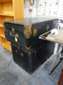 Large tin and brass-coloured metal travelling trunk and another (2)