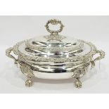 Victorian silver plate two-handled soup tureen, scroll relief decorated, on claw feet,