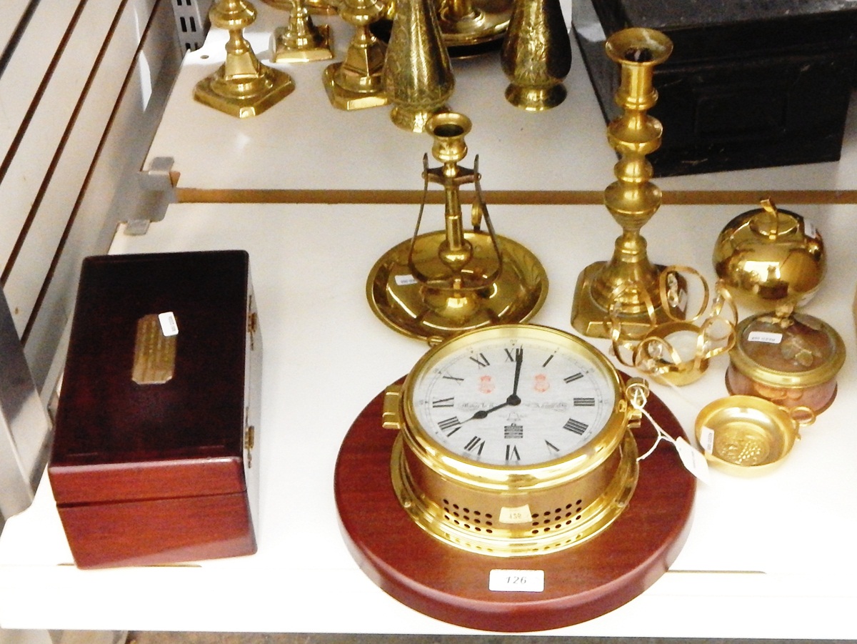 Modern ship's clock by Sewills of Liverpool, in brass case and mounted on wooden board,