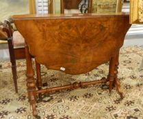 Figured walnut Sutherland table with shaped moulded top, on turned standard supports, shaped legs,