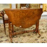 Figured walnut Sutherland table with shaped moulded top, on turned standard supports, shaped legs,