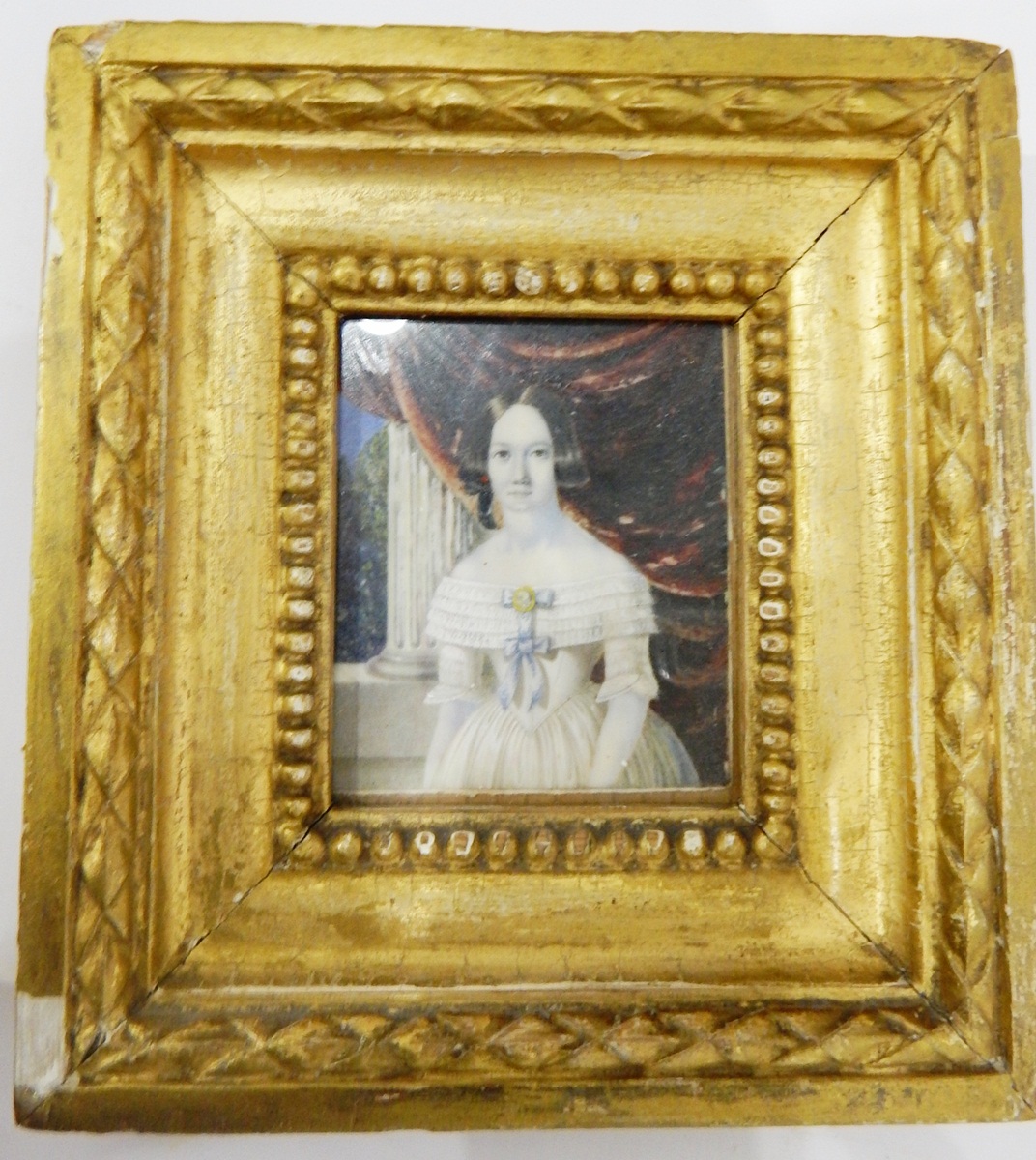 19th century school Painting on ivory Painted half-length portrait of a young girl in a white