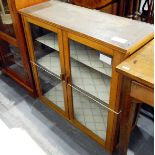 Two dwarf cabinets enclosed by glass panelled doors (2)