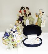 German porcelain figure group of a courting couple, 17cm high, with blue crowned 'K' mark to base,