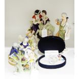 German porcelain figure group of a courting couple, 17cm high, with blue crowned 'K' mark to base,